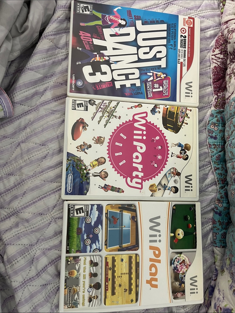 Nintendo Wii Game Set with Pink, White, Blue Covers